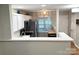 Modern kitchen featuring white cabinets, stainless steel appliances and quartz countertop seating area at 140 Marakery Rd # C, Mooresville, NC 28115
