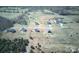 Overhead shot of homes on sizable plots of land surrounded by trees and fenced yards at 147 Stanfield Farm Ln, Stanfield, NC 28163