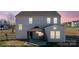 Here's a view of the rear of the home at dusk showing the cozy gazebo next to the siding at 147 Stanfield Farm Ln, Stanfield, NC 28163