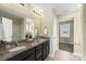 Bathroom with dual vanity sinks, granite countertops, and a view of the interior of the home at 147 Stanfield Farm Ln, Stanfield, NC 28163