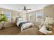 Comfortable bedroom with large windows, soft carpet, and a ceiling fan at 147 Stanfield Farm Ln, Stanfield, NC 28163