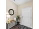 Entryway with wood-look floors, a modern console table with decor, and a geometric patterned rug at 147 Stanfield Farm Ln, Stanfield, NC 28163