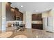 Kitchen featuring granite countertops, a stainless steel oven and microwave, and brown wood cabinets at 147 Stanfield Farm Ln, Stanfield, NC 28163