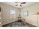 Bright office space features a ceiling fan, sleek desk, and a stylish animal print rug at 147 Stanfield Farm Ln, Stanfield, NC 28163