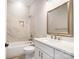 Well-lit bathroom with a modern vanity, framed mirror, and a tiled shower-tub combination at 154 Fox Hunt Dr, Mooresville, NC 28117