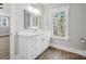 Bright bathroom featuring a large window, modern vanity, and plenty of natural light at 154 Fox Hunt Dr, Mooresville, NC 28117