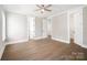 Bright bedroom with a ceiling fan, ample natural light, and multiple doors for easy access at 154 Fox Hunt Dr, Mooresville, NC 28117