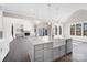 View of the island from the kitchen into the living room with a fireplace and large sliding glass doors at 154 Fox Hunt Dr, Mooresville, NC 28117