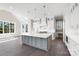 Open concept with white cabinets, an island, and stainless steel appliances at 154 Fox Hunt Dr, Mooresville, NC 28117