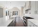 A shot of the island with a sink, cabinets, oven, and a view to the water out of the window at 154 Fox Hunt Dr, Mooresville, NC 28117