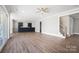 Open-concept living area with sleek finishes, a staircase, and sliding doors for indoor-outdoor living at 154 Fox Hunt Dr, Mooresville, NC 28117