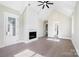 Bright living room with cathedral ceiling, fireplace with white shiplap, and open access to adjacent rooms at 154 Fox Hunt Dr, Mooresville, NC 28117