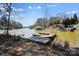 Waterfront with docks and boat slips and houses on the opposite shore under a blue sky at 154 Fox Hunt Dr, Mooresville, NC 28117