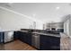 Stylish wet bar with dark cabinetry, elegant countertops, and stainless steel appliances at 154 Fox Hunt Dr, Mooresville, NC 28117
