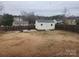 Fenced backyard with shed and a fire pit area near residential neighborhood at 1638 Marmot Pl, Concord, NC 28025