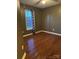 Bedroom with beautiful wood floors and great natural lighting from the window at 1638 Marmot Pl, Concord, NC 28025