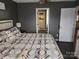 Cozy bedroom features stylish bedding and a view into the walk-in closet at 1638 Marmot Pl, Concord, NC 28025