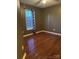 Cozy bedroom with hardwood floors, neutral paint and window with modern pattern curtain at 1638 Marmot Pl, Concord, NC 28025