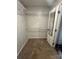 Walk-in closet with carpet, wire shelving, and a full length mirror attached to the door at 1638 Marmot Pl, Concord, NC 28025
