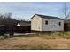 View of shed and backyard with a wood fence and gravel fire pit at 1638 Marmot Pl, Concord, NC 28025