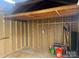 Shed interior with unfinished walls and plenty of room for storage at 1638 Marmot Pl, Concord, NC 28025