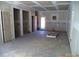 Spacious unfinished room awaiting customization, with drywall and doorway to the outside at 184 Oak Creek Rd, Statesville, NC 28625