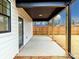 Covered back porch with painted posts overlooks the backyard and is great for entertaining at 205 Skyline Cir, Salisbury, NC 28146