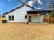 The home's exterior showcases a covered back porch and spacious backyard with a wood fence at 205 Skyline Cir, Salisbury, NC 28146