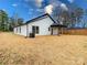 Spacious backyard with fresh pine straw landscaping and wood fencing at 205 Skyline Cir, Salisbury, NC 28146
