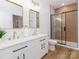 Stylish bathroom boasts double sinks, gold fixtures, and sleek walk-in shower with sliding glass door at 205 Skyline Cir, Salisbury, NC 28146