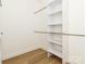 Walk-in closet with custom shelving and laminate floors; offers plenty of storage space at 205 Skyline Cir, Salisbury, NC 28146
