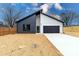 New construction home with a modern design, two-car garage and black and white color scheme at 205 Skyline Cir, Salisbury, NC 28146