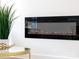 Modern electric fireplace with crystal embellishments adding ambiance to a bright living space at 205 Skyline Cir, Salisbury, NC 28146