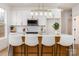 Bright kitchen featuring modern cabinets, a stylish island with bar stools, and stainless steel microwave at 205 Skyline Cir, Salisbury, NC 28146