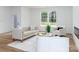 Bright living room with modern decor, a tufted sofa and large windows providing natural light at 205 Skyline Cir, Salisbury, NC 28146