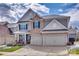 Beautiful two-story home with stone accents, a two-car garage, and well-maintained front yard at 2050 Saddlebred Dr, Iron Station, NC 28080