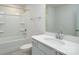 Bright bathroom featuring a tub-shower combo and single sink with vanity, creating a clean aesthetic at 2058 Skyhawk Dr, Lake Wylie, SC 29745