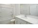 Bright bathroom with single vanity, white cabinets and tub with shower and tile surround at 2058 Skyhawk Dr, Lake Wylie, SC 29745