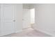 Neutral bedroom with carpet and white trim features two doors to closet and bathroom at 2058 Skyhawk Dr, Lake Wylie, SC 29745