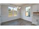 Bright dining room with hardwood floors, large windows with view of backyard, and classic molding at 2058 Skyhawk Dr, Lake Wylie, SC 29745