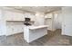 Modern kitchen with white cabinets, stainless appliances, an island and hard surface countertops at 2058 Skyhawk Dr, Lake Wylie, SC 29745