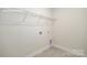 Laundry room with a wire rack shelf and tile flooring providing functionality and convenience at 2058 Skyhawk Dr, Lake Wylie, SC 29745