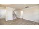 Large living room featuring hardwood floors, neutral paint, a staircase and multiple doors at 2058 Skyhawk Dr, Lake Wylie, SC 29745
