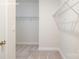 Spacious walk-in closet features carpet flooring and wire shelving for maximum storage at 2058 Skyhawk Dr, Lake Wylie, SC 29745