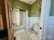 Charming bathroom with a shower-tub combination, subway tile, and patterned floor tiles at 20711 Bethel Church Rd, Cornelius, NC 28031