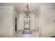 Welcoming foyer with tiled floors, front door, and chandelier, setting an elegant tone at 20711 Bethel Church Rd, Cornelius, NC 28031