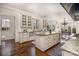 Bright kitchen featuring a large island with seating and ample cabinet space at 20711 Bethel Church Rd, Cornelius, NC 28031
