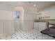 Well-lit laundry room with washer, dryer, and ample storage space at 20711 Bethel Church Rd, Cornelius, NC 28031