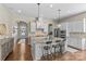 Spacious kitchen with a large island, granite countertops, and seating, perfect for entertaining guests at 2111 Augusta National Dr, Denver, NC 28037