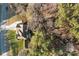 Aerial view of a home nestled amongst trees, showcasing the natural surroundings at 214 Harbor Landing Dr, Mooresville, NC 28117